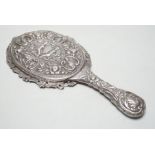 A late Victorian embossed silver hand mirror, Samuel Walton Smith, Birmingham, 1891, 27cm.