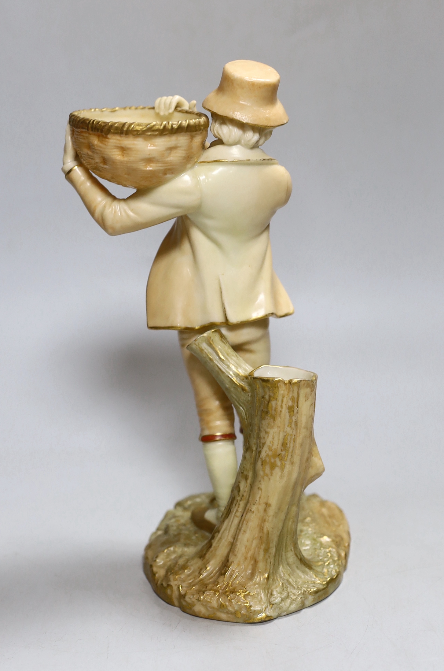A Royal Worcester figure of a boy, highlighted in gold, with a wicker basket in his hands, painted - Image 2 of 3