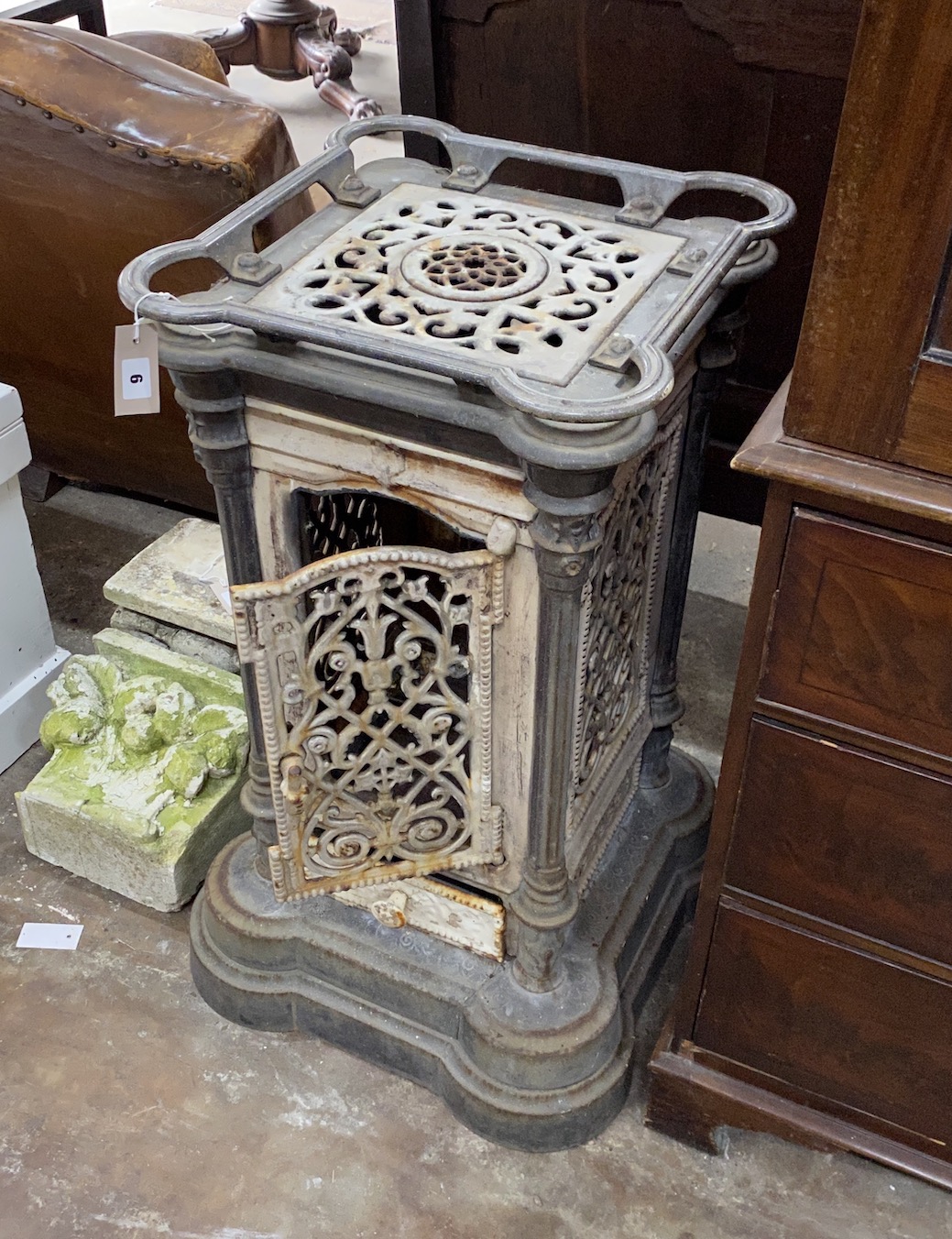 A 19th century French enamelled cast iron conservatory heater, lacking burner, width 44cm, height