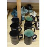 A collection of Dickerware pottery including mugs, baskets and jugs, the largest 14cm high