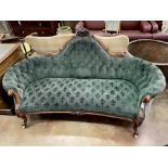 A Victorian walnut settee upholstered in green fleur de lys buttoned fabric, length 190cm, depth
