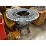 A painted wrought iron circular garden table, by Russell Woodard, diameter 88cm, height 70cm (