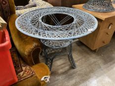 A painted wrought iron circular garden table, by Russell Woodard, diameter 88cm, height 70cm (