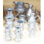 A collection of 19th/20th century pewter jugs, mugs and flagons (15), large jug 20cm high