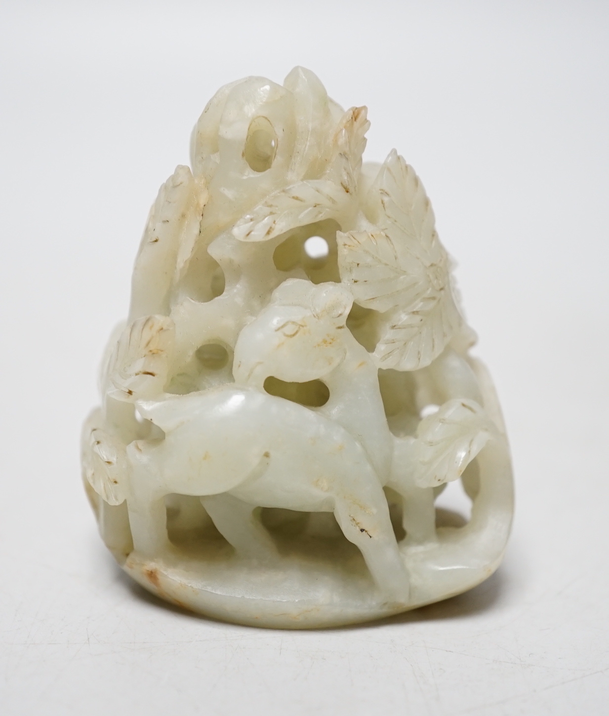 A Chinese pale celadon jade ‘deer’ carving, 7cm