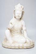 A Chinese carved marble figure of Guanyin, 42cm high