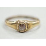 An antique yellow metal and single stone rose cut diamond set ring, size N, gross weight 1.1 grams.