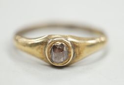An antique yellow metal and single stone rose cut diamond set ring, size N, gross weight 1.1 grams.