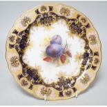 A Royal Worcester plate painted with fruit and berries by R. Sebright, signed, under a blue and gilt
