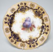 A Royal Worcester plate painted with fruit and berries by R. Sebright, signed, under a blue and gilt
