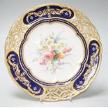 A Coalport plate with pierced border enamelled with white flowers and neo-classical raised paste