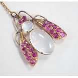 A yellow metal moonstone and ruby cluster set bug brooch, 27mm, gross weight 4.9 grams.
