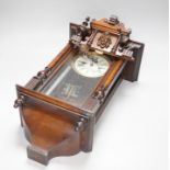 A small mahogany Vienna wall clock, 57cm high