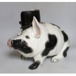 A large and rare Wemyss pig, with top hat and monocle, impressed mark WEMYSS WARE, R.H. & S, 45cm in