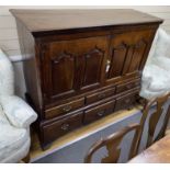 A George III oak press cupboard, width 142cm, depth 51cm, height 131cm