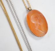 A yellow metal mounted oval intaglio carnelian stone, carved with the bust of gentleman to sinister,