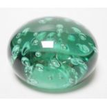 A large Victorian green glass domed dump or paperweight, 14 cm diameter