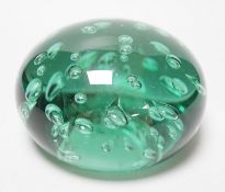 A large Victorian green glass domed dump or paperweight, 14 cm diameter