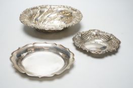 A late Victorian repousse silver oval bowl, William Comyns, London, 1889, 21.1cm and two other