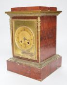 A French gilt metal mounted rouge marble mantel clock, first half 19th century, engine turned