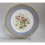 A 19th century Sevres plate painted flower under a blue and gilt border, marked S61 for 1861