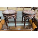 A pair of Chinese circular rouge marble topped mother of pearl inlaid hardwood jardiniere stands,