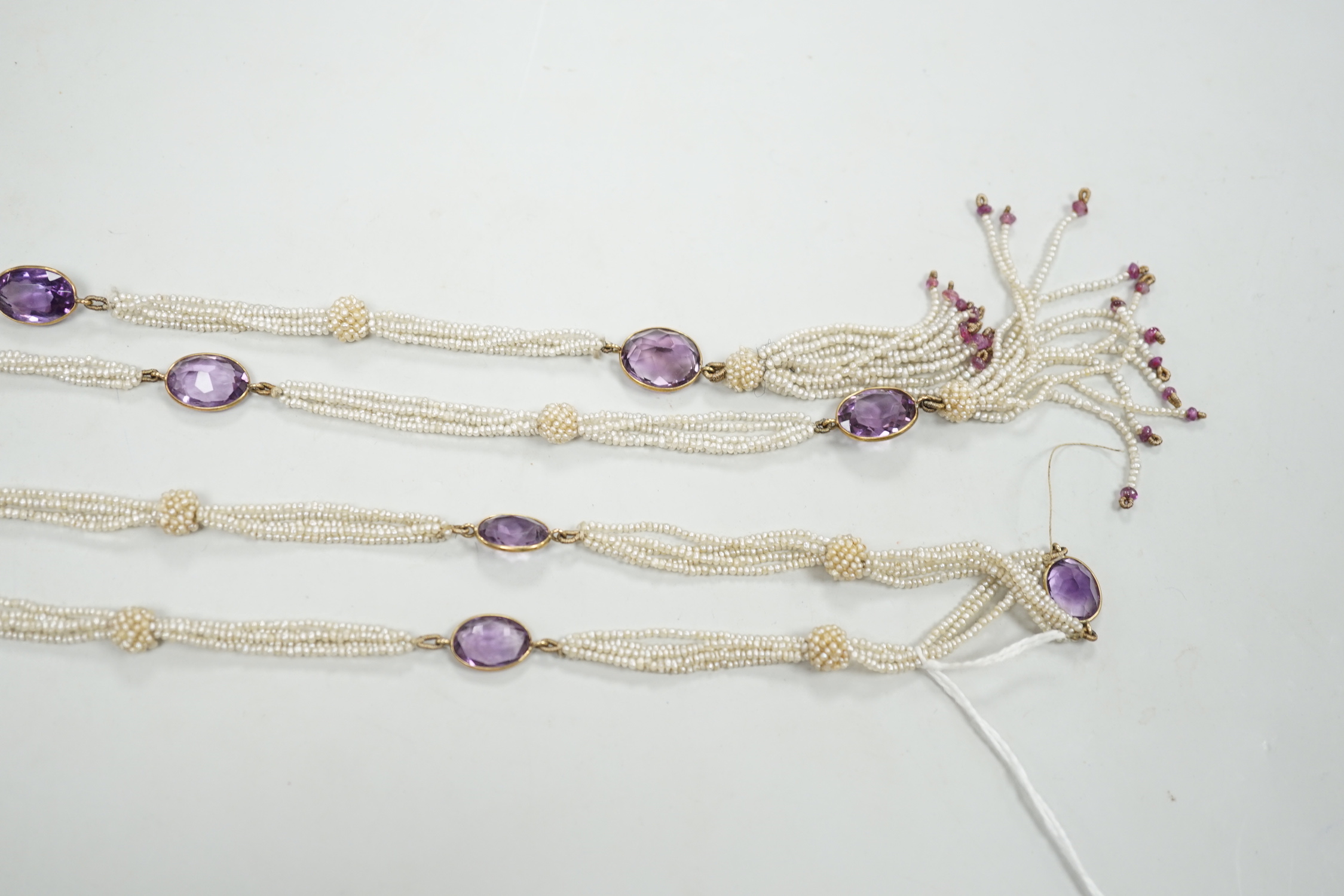 A 19th century Indian multi strand seed pearl and oval cut amethyst set long necklace, with gem - Image 4 of 4