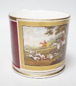 A 19th century English porcelain mug painted horses and riders with hunting dogs in a chase scene,