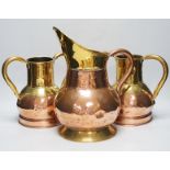 A pair late 19th century copper and brass twin handled vases and a similar jug, the largest 35cm