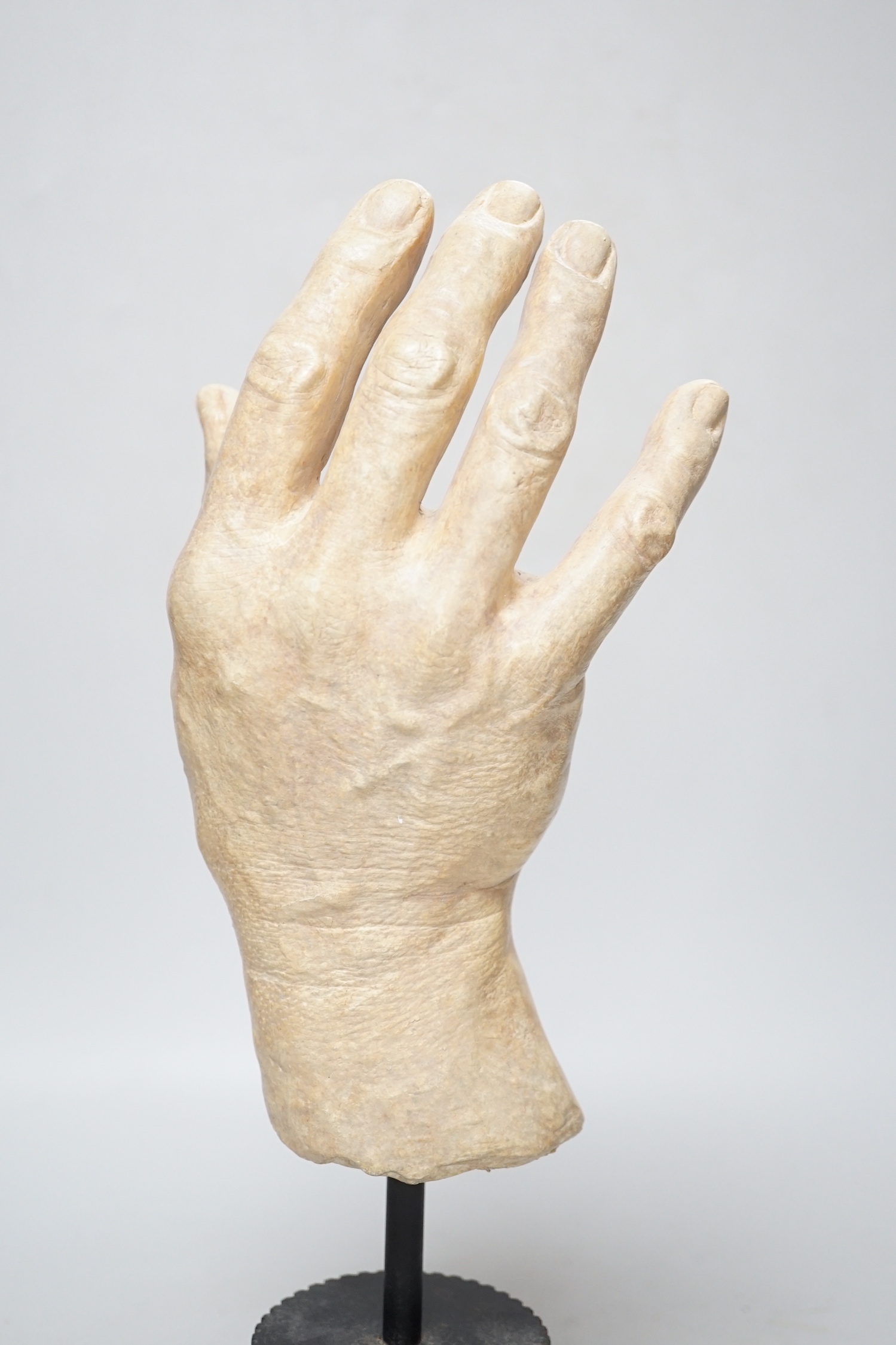 A composition model of a hand raised on a circular column base, 38cm high - Image 4 of 4