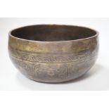 A Tibetan singing bowl with Sanskrit inscription, 19cm diameter