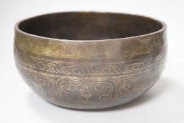 A Tibetan singing bowl with Sanskrit inscription, 19cm diameter