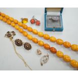 A single strand graduated oval amber bead necklace, 98cm, gross weight 94 grams and other sundry