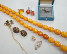 A single strand graduated oval amber bead necklace, 98cm, gross weight 94 grams and other sundry