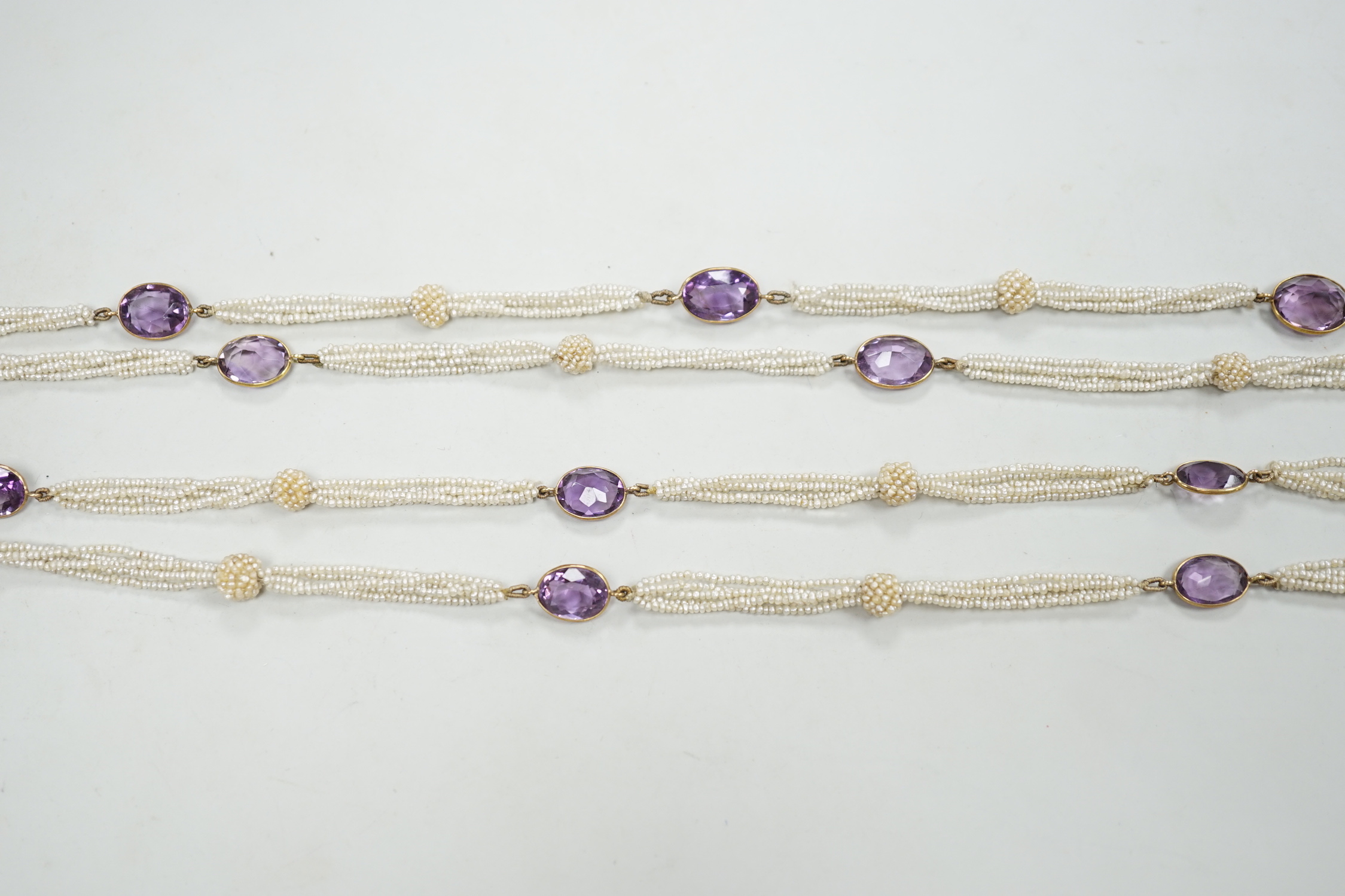 A 19th century Indian multi strand seed pearl and oval cut amethyst set long necklace, with gem - Image 3 of 4