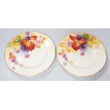 A pair of Royal Worcester lobed tea plates painted with autumnal leaves and berries by Kitty
