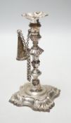 A George II cast silver taper stick, William Gould, London, 1751, with later George IV