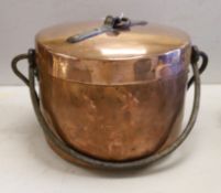 A French copper cooking pot and cover with swing handle, 27cm high