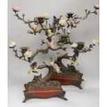 A pair of Victorian style bronzed metal and porcelain three branch candelabra, modelled as birds