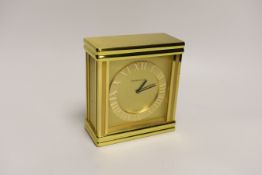 A Tiffany & Co. Swiss made brass clock with booklet, numbered 215885, 16cm high