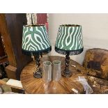 A pair of oak barley twist table lamps with green and white zebra print shades, height including