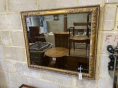 A rectangular giltwood and composition wall mirror, width 86cm, height 74cm