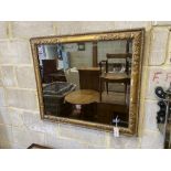 A rectangular giltwood and composition wall mirror, width 86cm, height 74cm