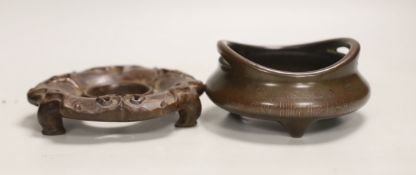 A Chinese bronze censer, on hardwood stand, 12.5cm diameter