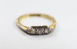 An 18ct, plat and three stone diamond ring, size N/O, gross weight 2.5 grams.