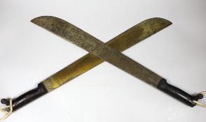 A WW2 U.S. military issue Disston machete and a True Temper machete, both dated 1943