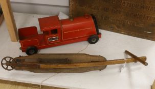 A Tri-Ang Express tinplate toy locomotive and an early 20th century beech folding scooter, the train