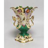 A 19th century Coalport two handled floral encrusted vase painted with flowers and a green ground,