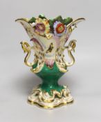A 19th century Coalport two handled floral encrusted vase painted with flowers and a green ground,