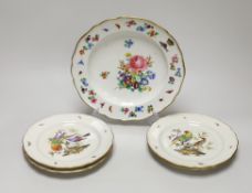 A Meissen plate with crown and fish crest boldly painted with flowers, crossed swords in blue, and